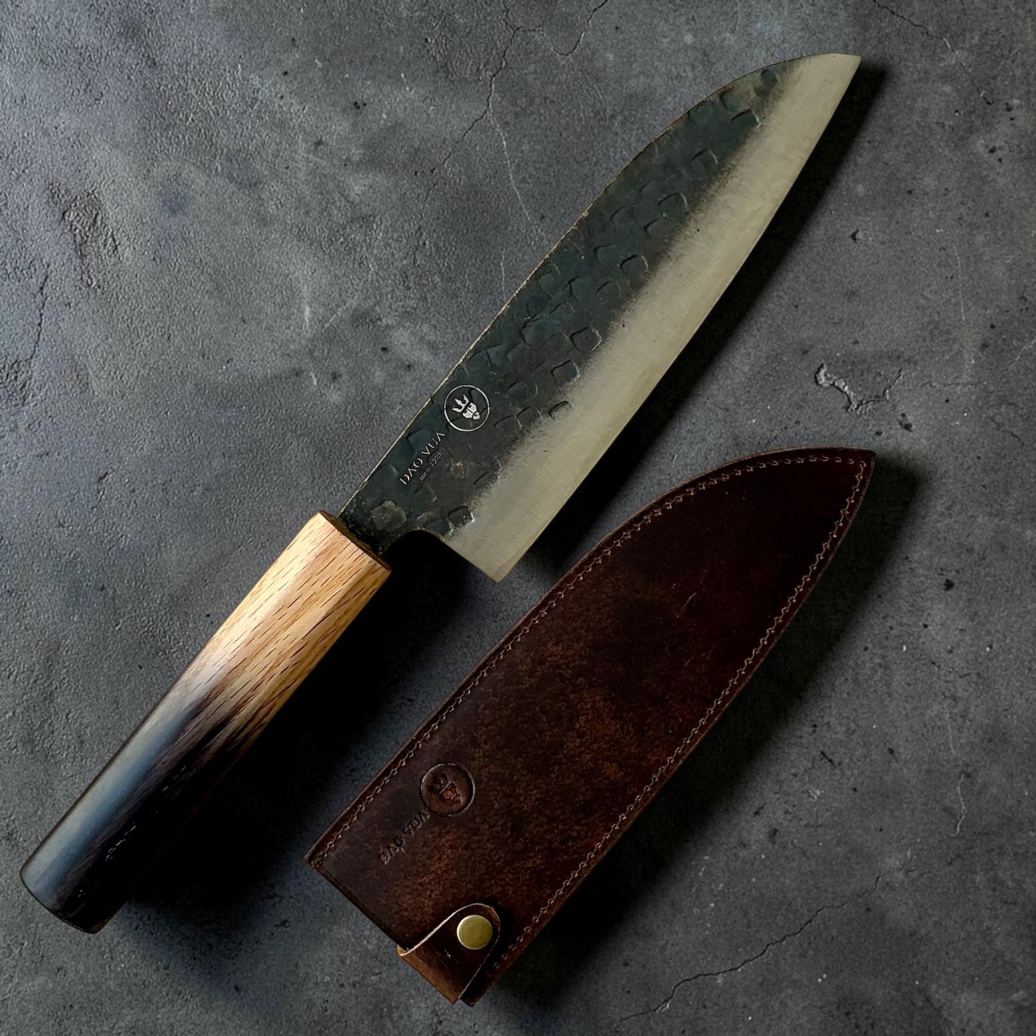 Dao Vua V3 52100 Kuro Tsuchime Santoku with burnt wood handle and leather sheath