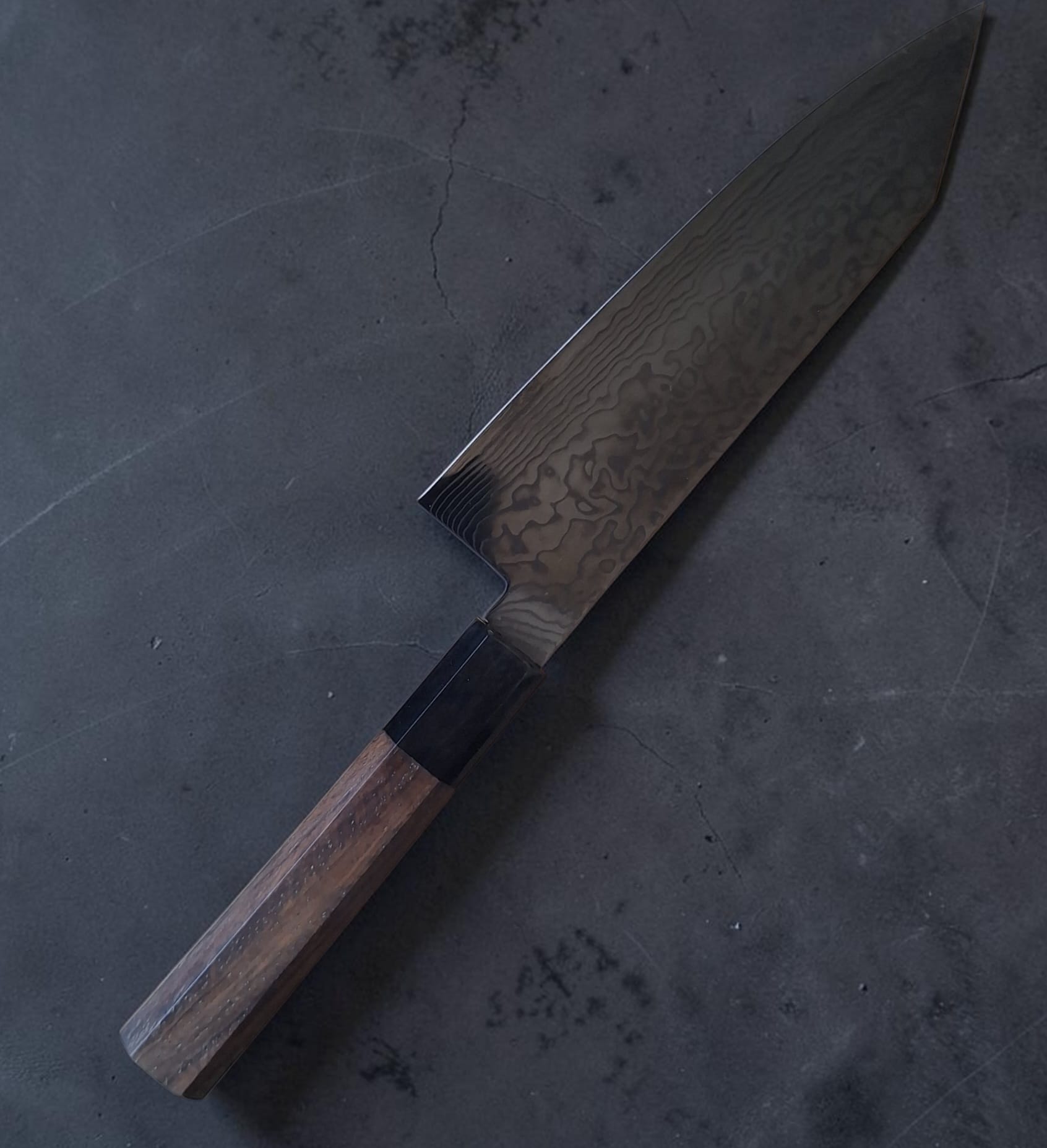 Hatsukokoro Ryuhyo black SG2 Damascus Bunka 180mm with walnut handle, angled blade detail