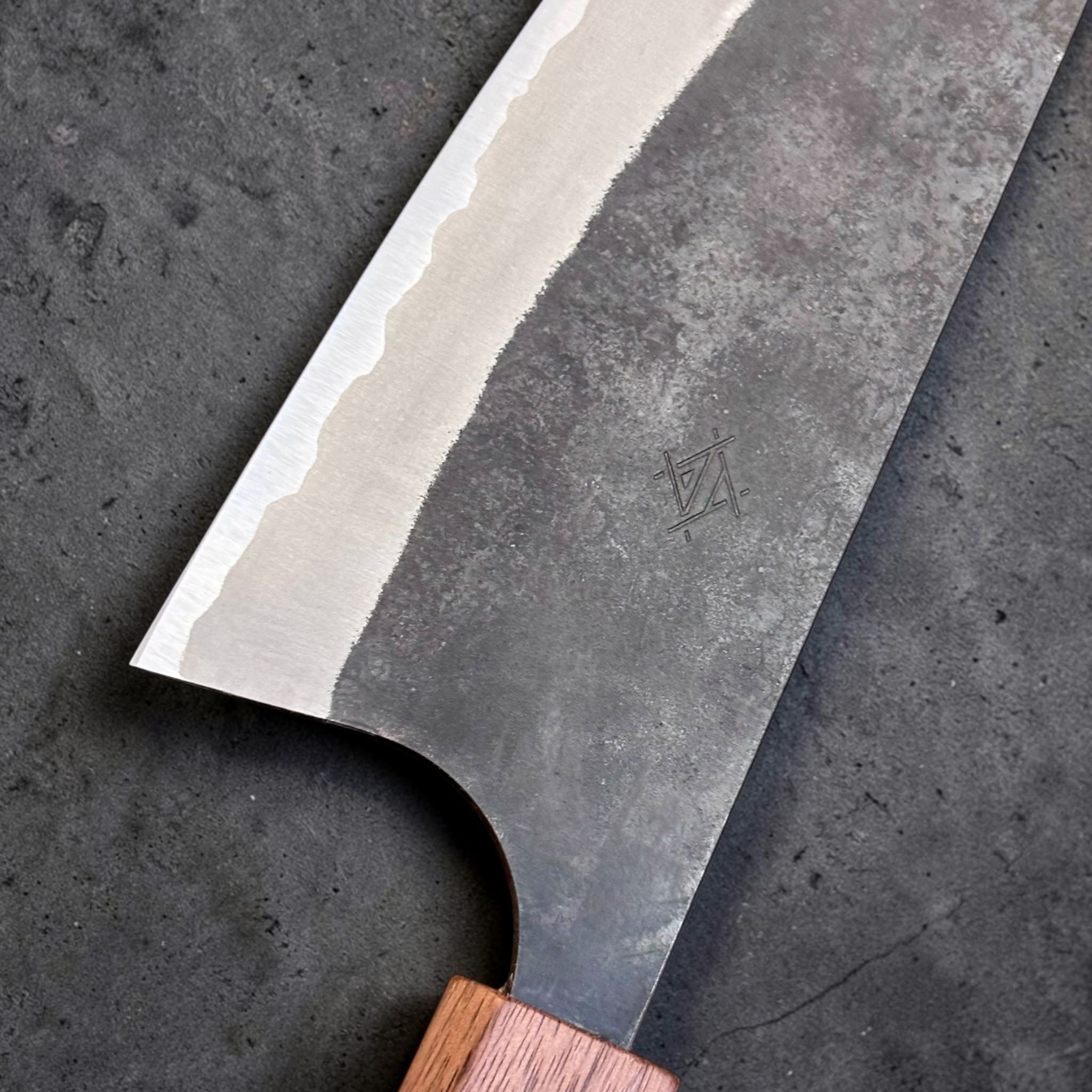 Imai AS Kurouchi USA Gyuto 220 mm with Sanjo walnut handle, close-up of kurouchi blade finish, maker mark, and polished edge.