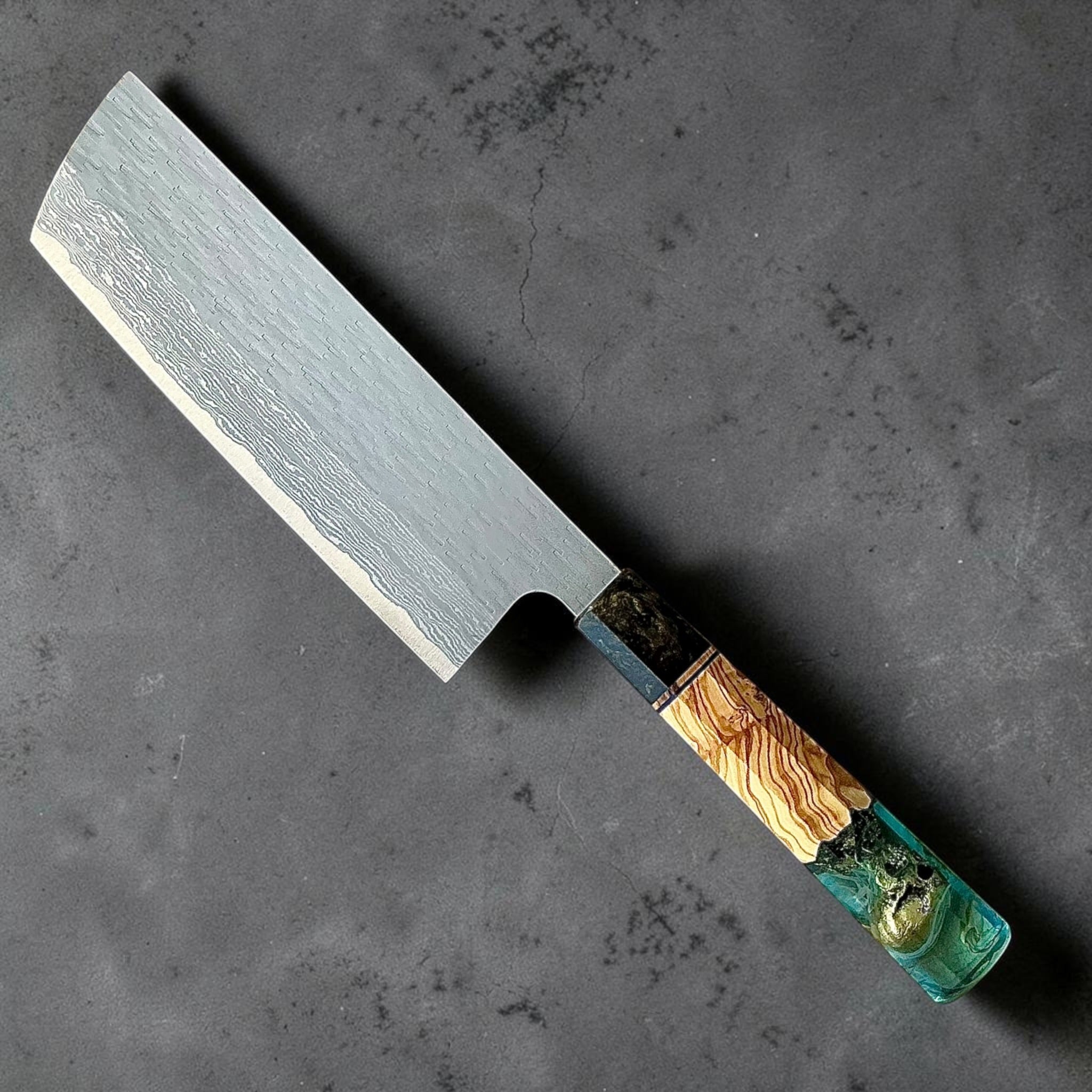 Nigara VG-XEOS polished tsuchime nakiri 165mm with blue-green Prisma resin and wood custom handle, front view.