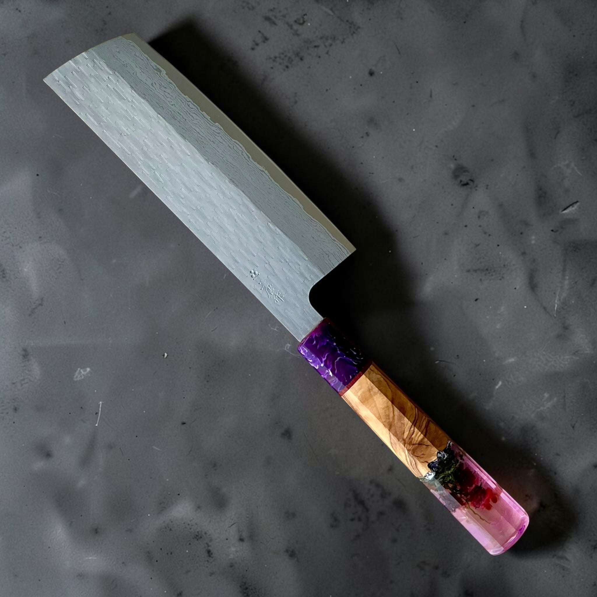 Nigara VG-XEOS polished tsuchime nakiri 165mm with purple-pink Prisma resin and wood custom handle, front view.