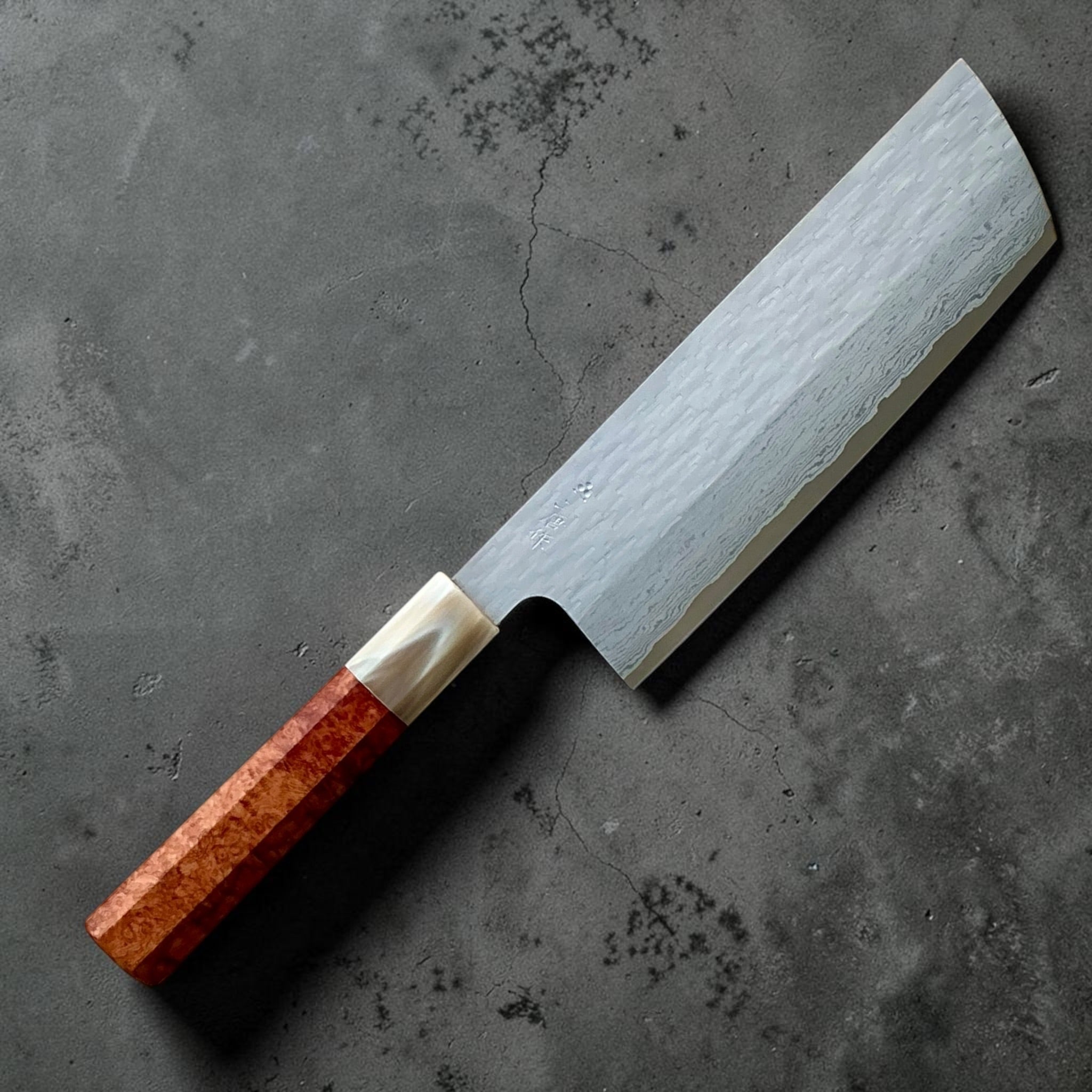 Nigara VG-XEOS polished tsuchime nakiri 165mm with cypress and buffalo horn handle, angled front view.