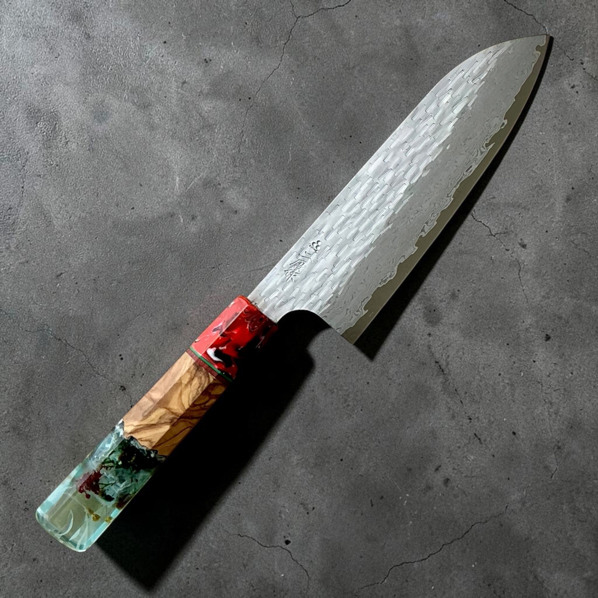 Nigara VG-XEOS polished tsuchime santoku 170mm with red-aqua Prisma custom handle, kanji-side view.