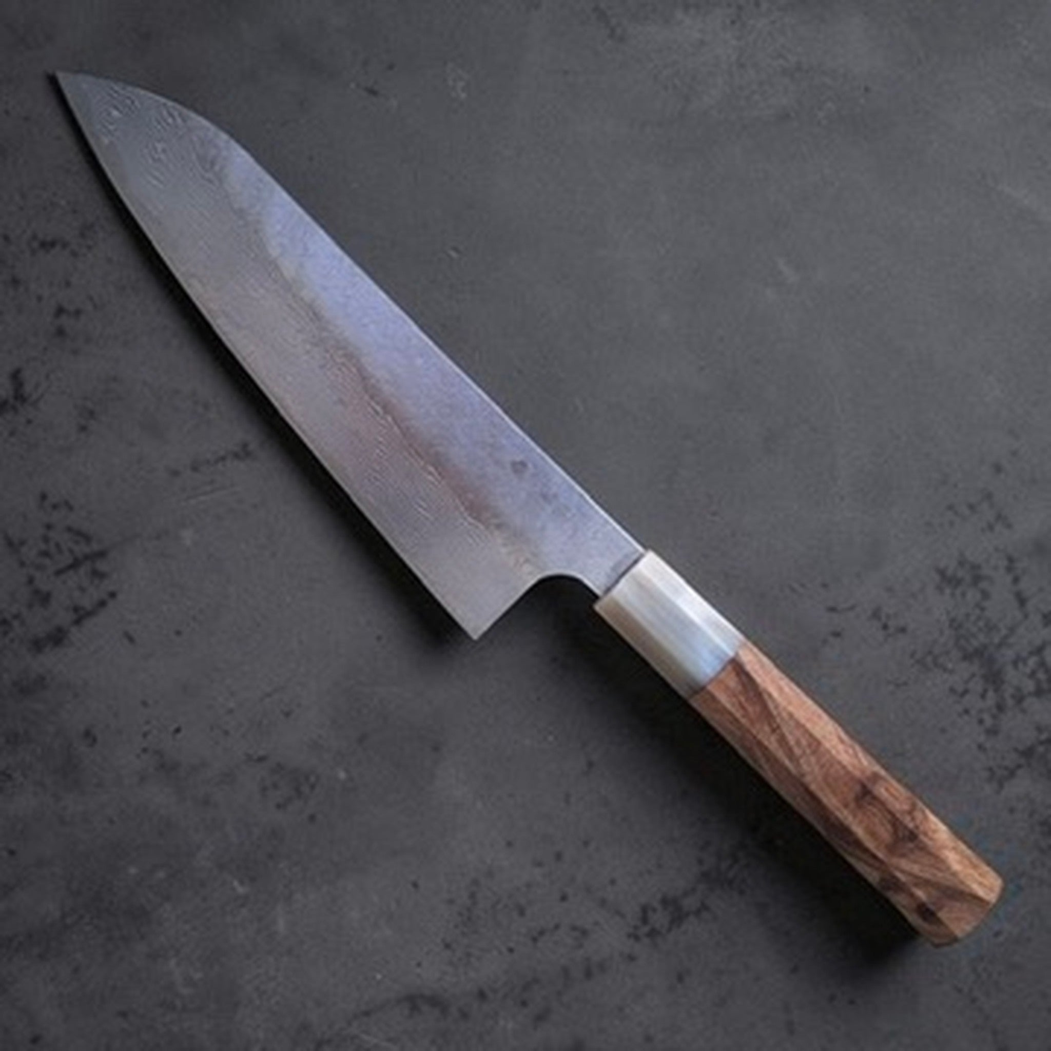 Nigara VG-XEOS Tsuchime Gyuto 210 mm with cypress and horn handle, angled product photo showing the Damascus blade finish.