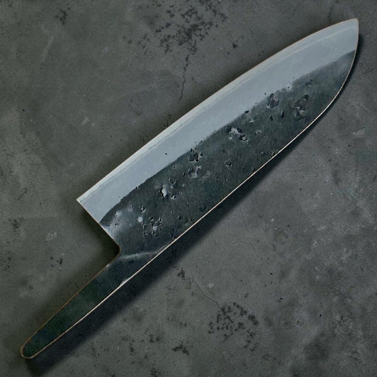 Reverse side of the Tokushu Knife Blue #2 Nashiji Santoku 165 mm blade without a handle