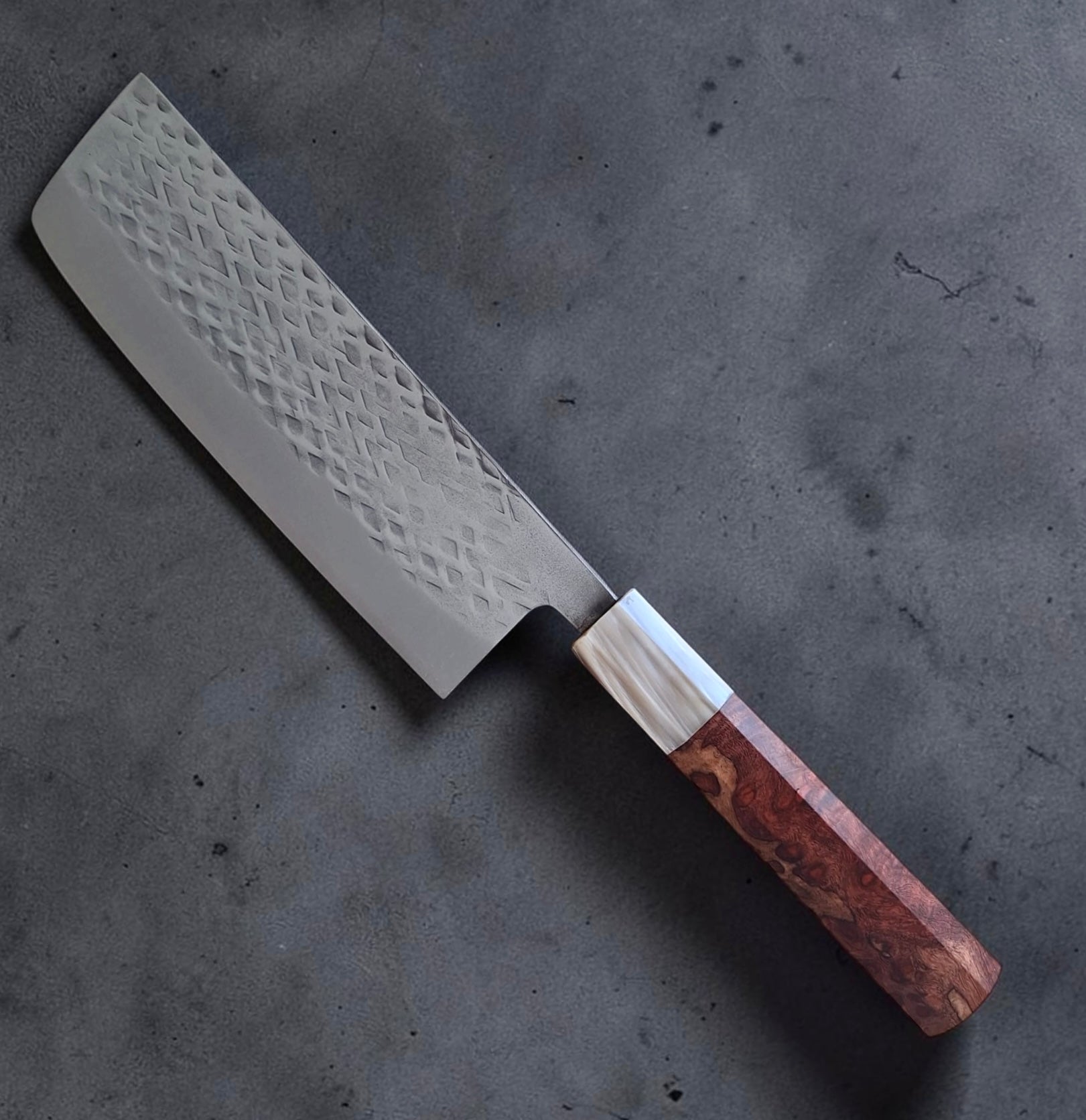 Full angled view of Tokushu Knife SLD Tsuchime Nakiri with hammered blade and custom wa handle