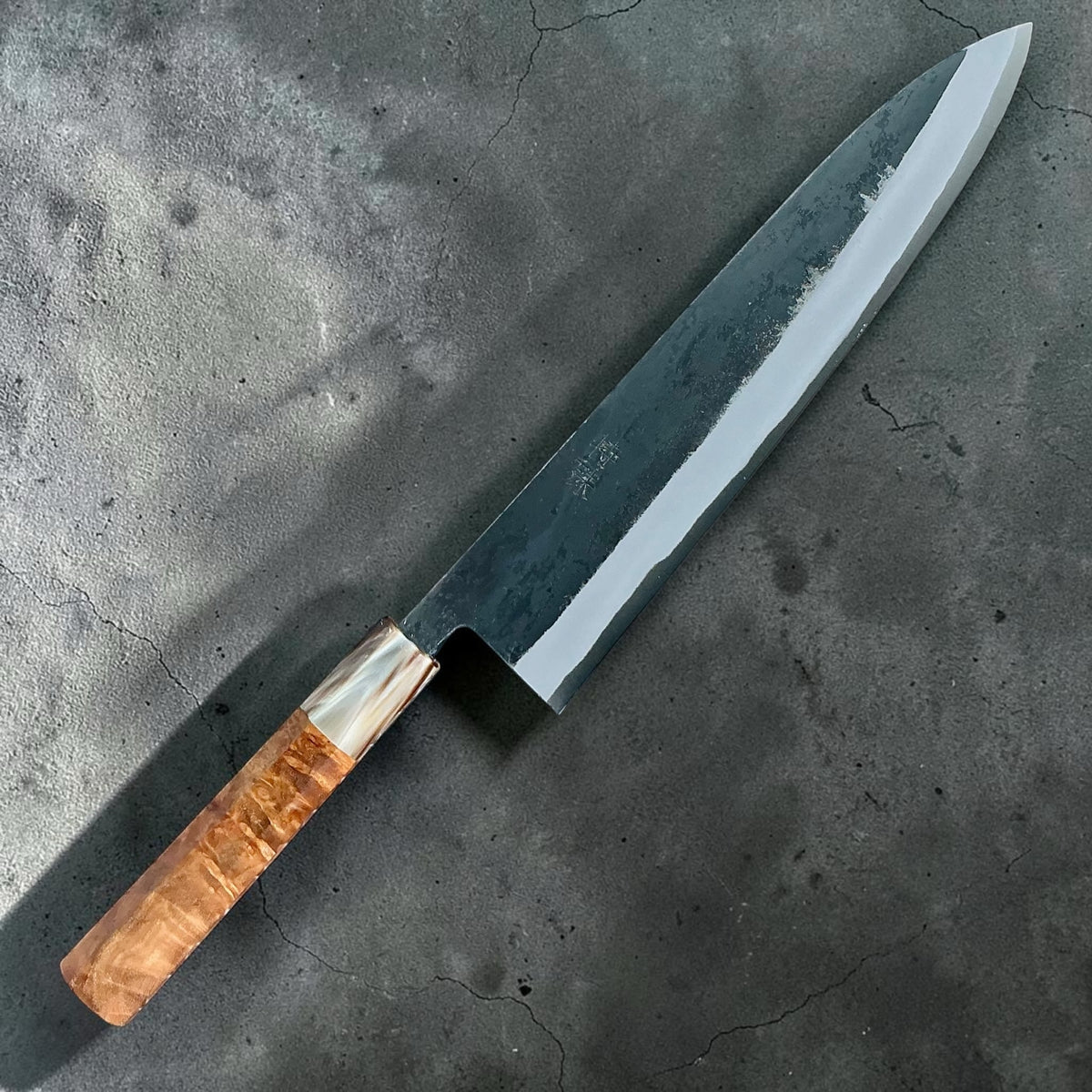 Tokushu Knife White No. 2 iron clad forged finish Gyuto 240 mm, full amboyna & horn, angled front view #handle_full amboyna & horn
