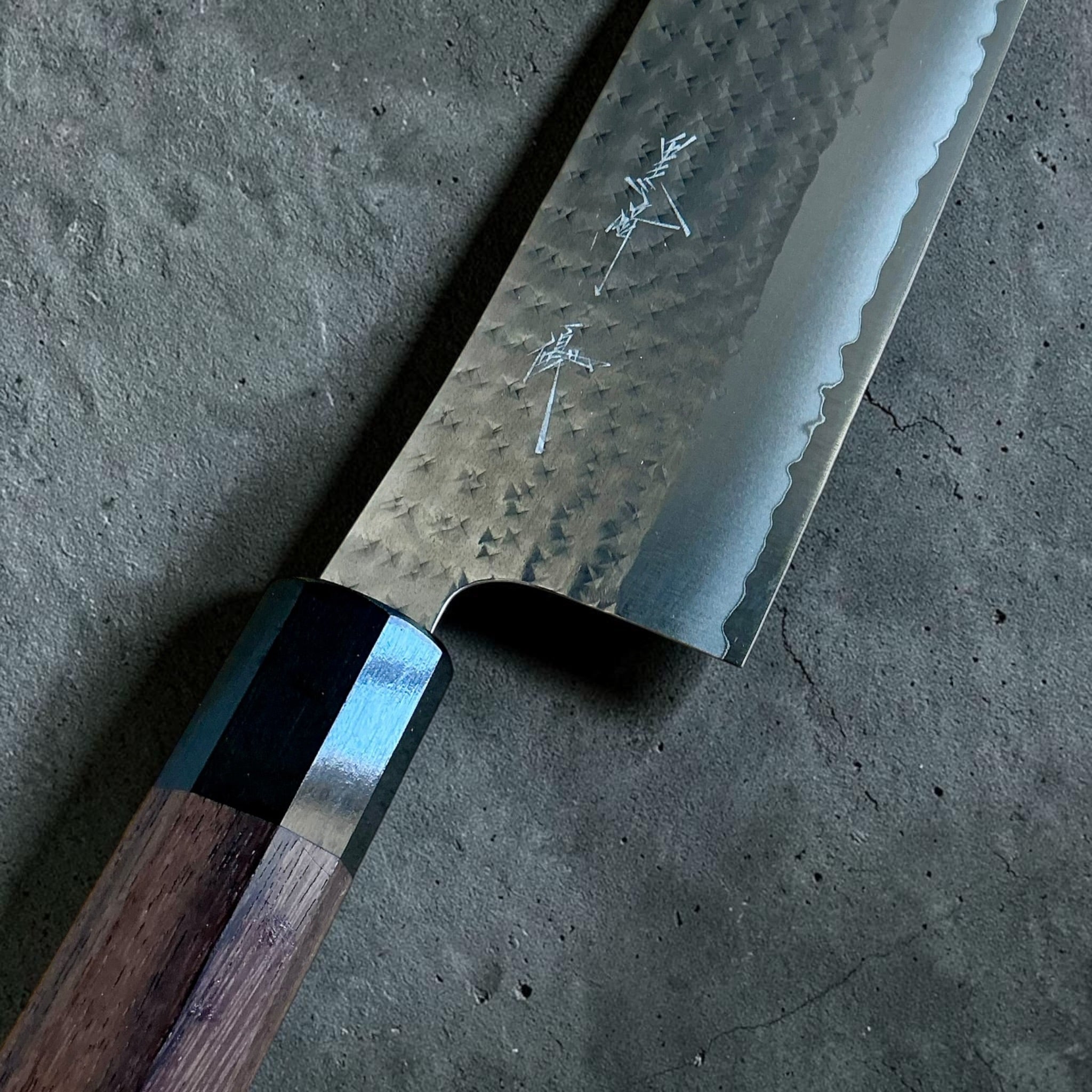Close-up of Yu Kurosaki Kokusen AS Nakiri blade engraving and rosewood handle