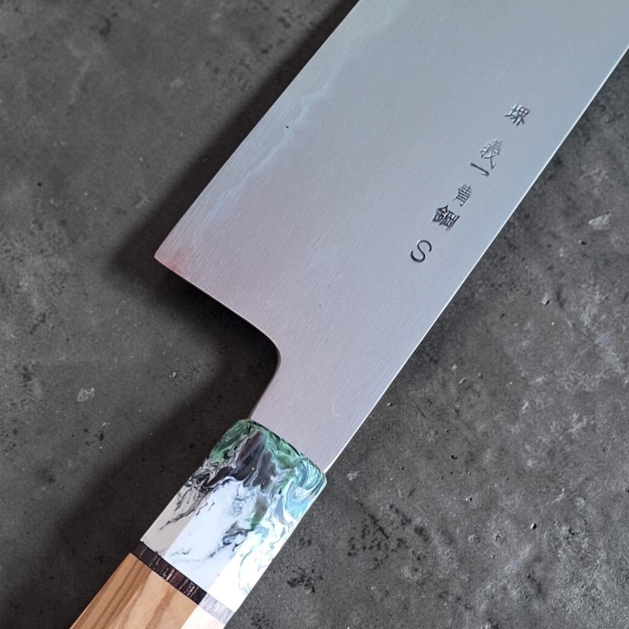 Yoshikazu Tanaka Aogami Super Steel Gyuto 255mm, close-up of kanji, machi area, and green-white Prisma ferrule.