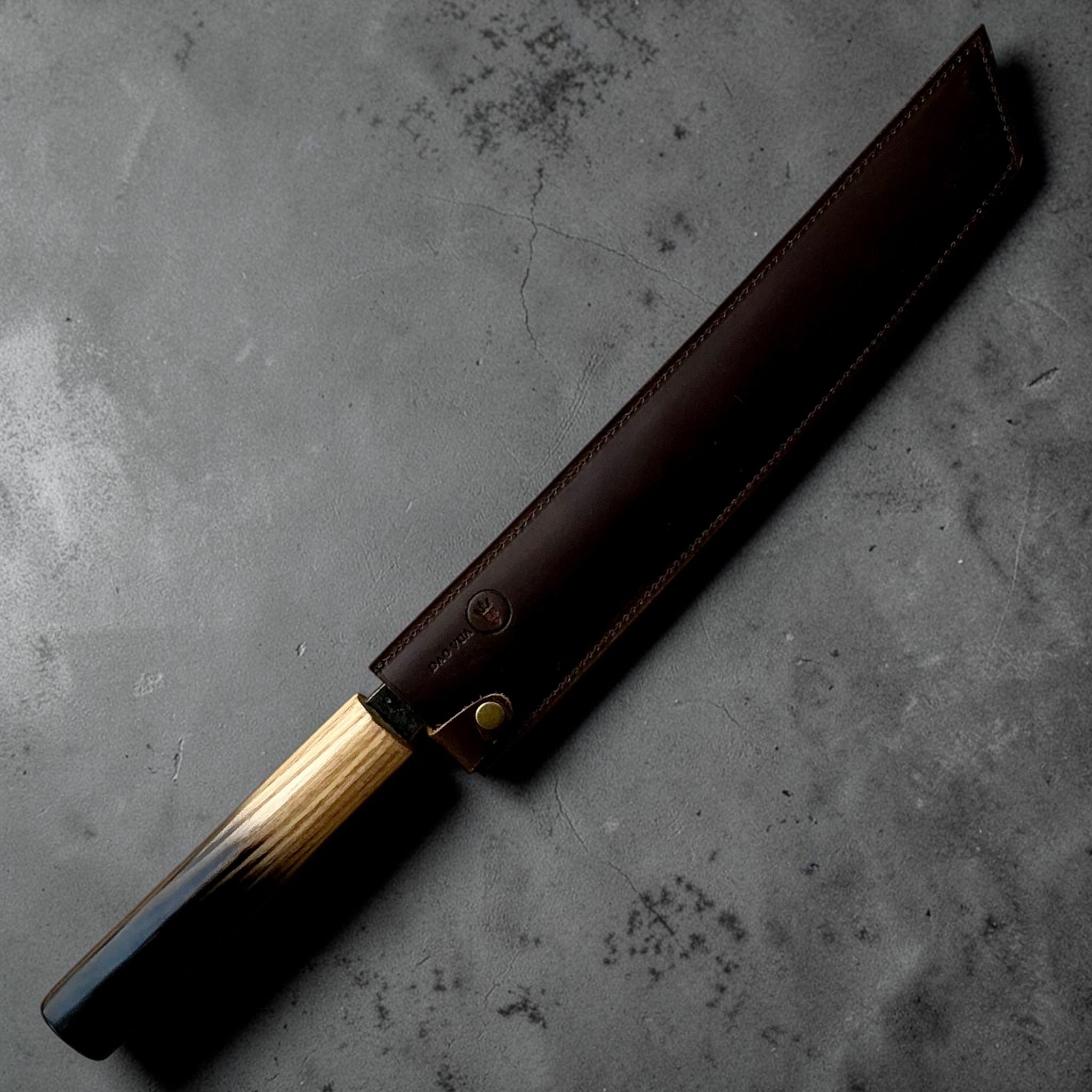 Dao Vua Kuro Tsuchime Sujihiki 270mm secured in brown leather sheath