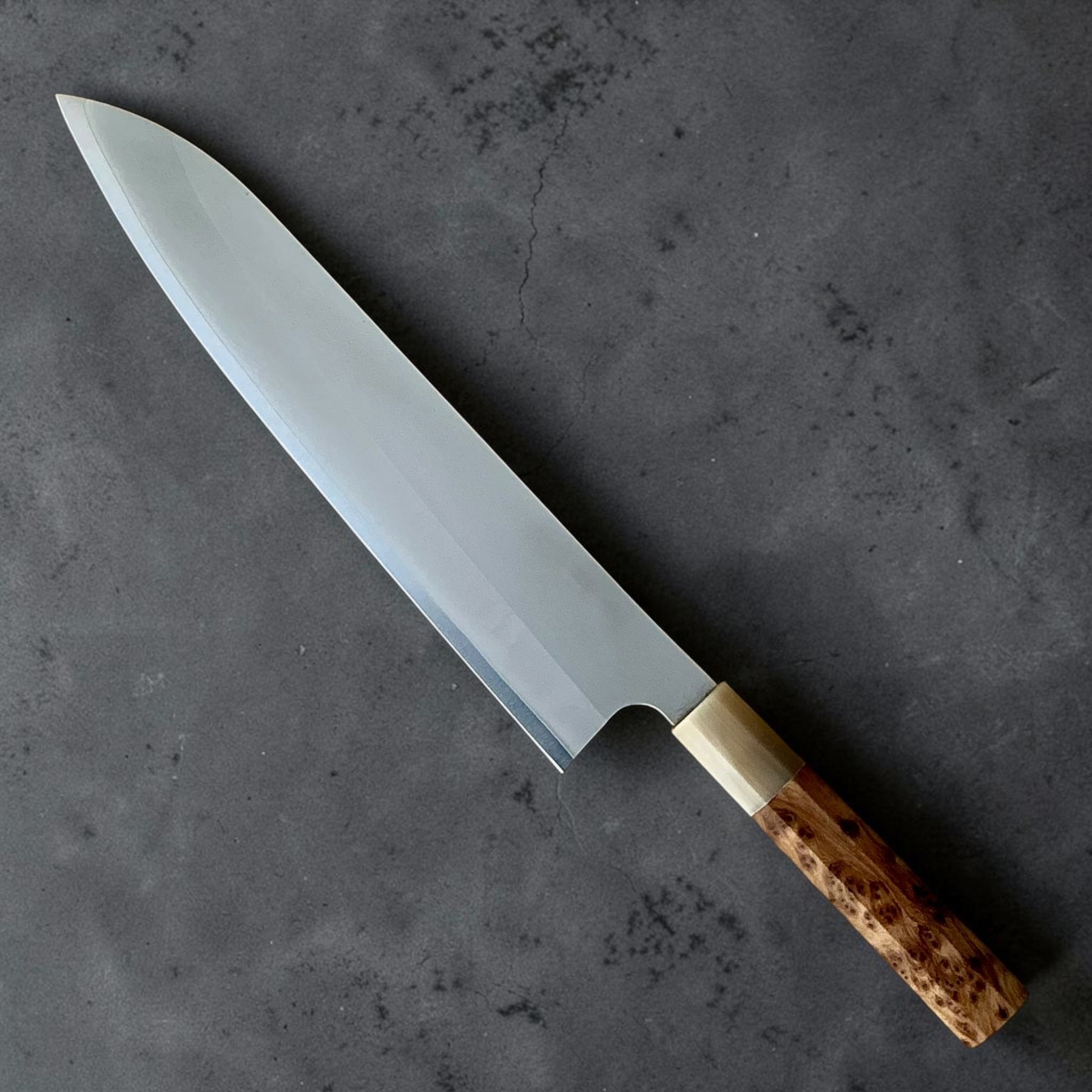 Reverse blade view of Daruma Hamono Ginsan #3 Migaki Gyuto 240mm with Amboyna Burl and Horn handle.