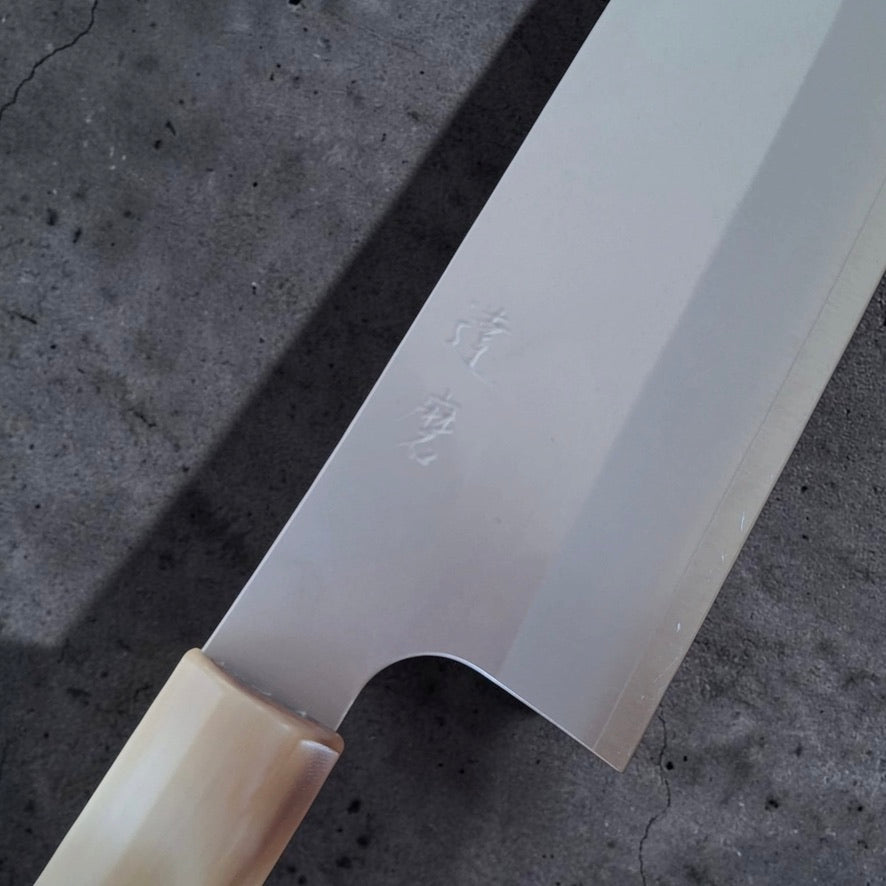 Daruma Hamono Ginsan #3 Migaki Gyuto 210 mm, close-up of the polished blade face with kanji and horn ferrule.