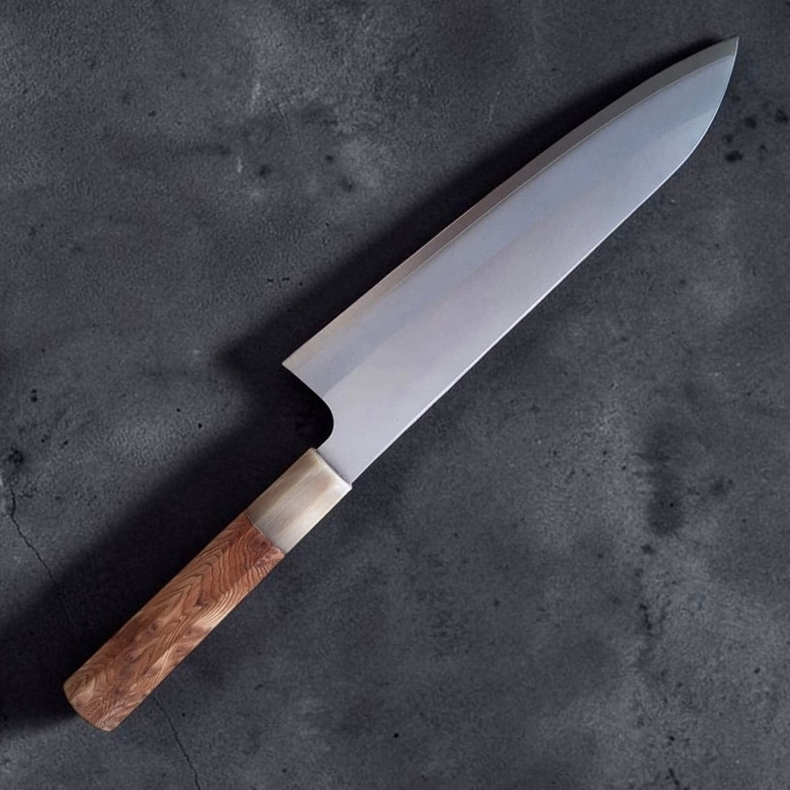 Daruma Hamono Ginsan #3 Migaki Gyuto 210 mm, angled product photo showing the gyuto profile and wood wa-handle.