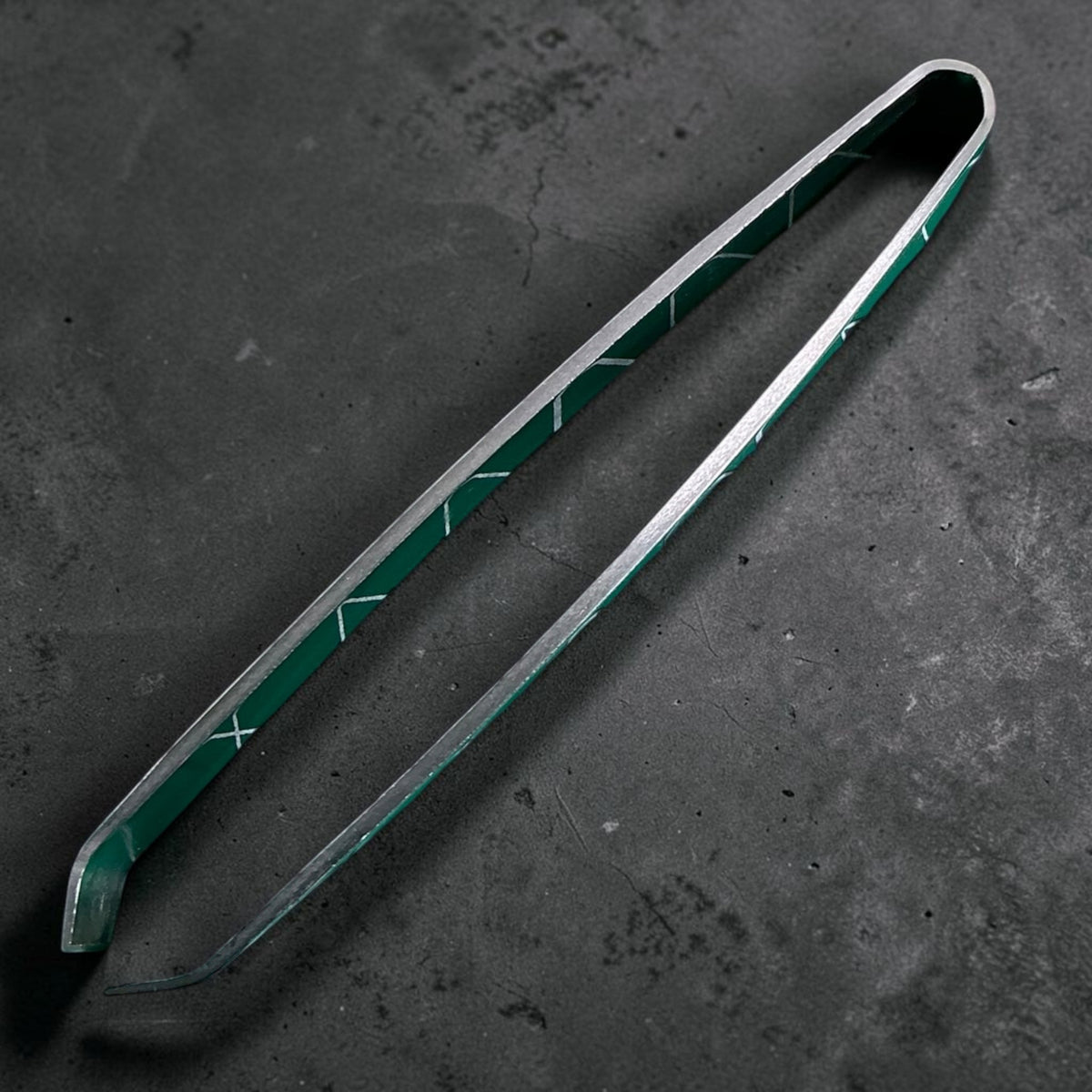 Fish Bone Tweezer Small in side profile showing curved gripping tips