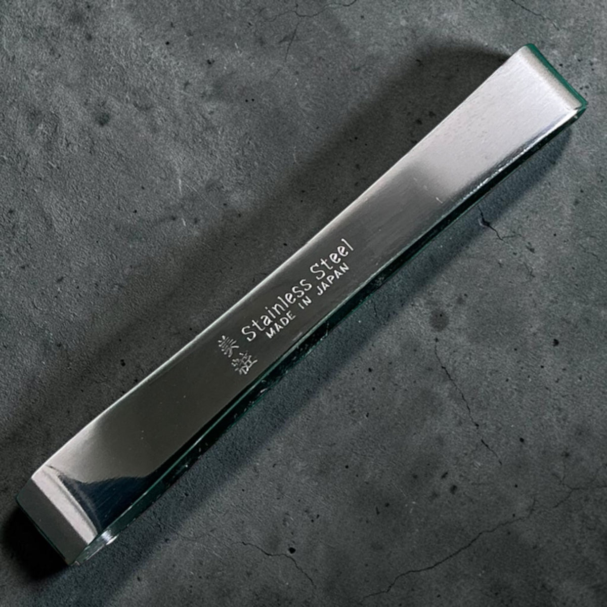 Fish Bone Tweezer Small showing stainless steel finish and Made in Japan engraving
