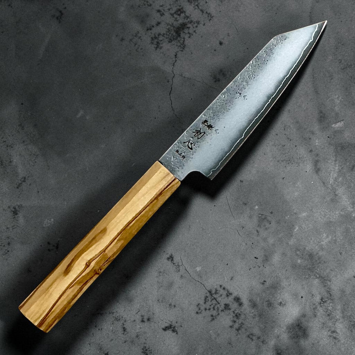 Hatsukokoro Ginrei Silver 3 Nashiji Kiritsuke Petty 125mm with mono olive wood handle, full knife angled view