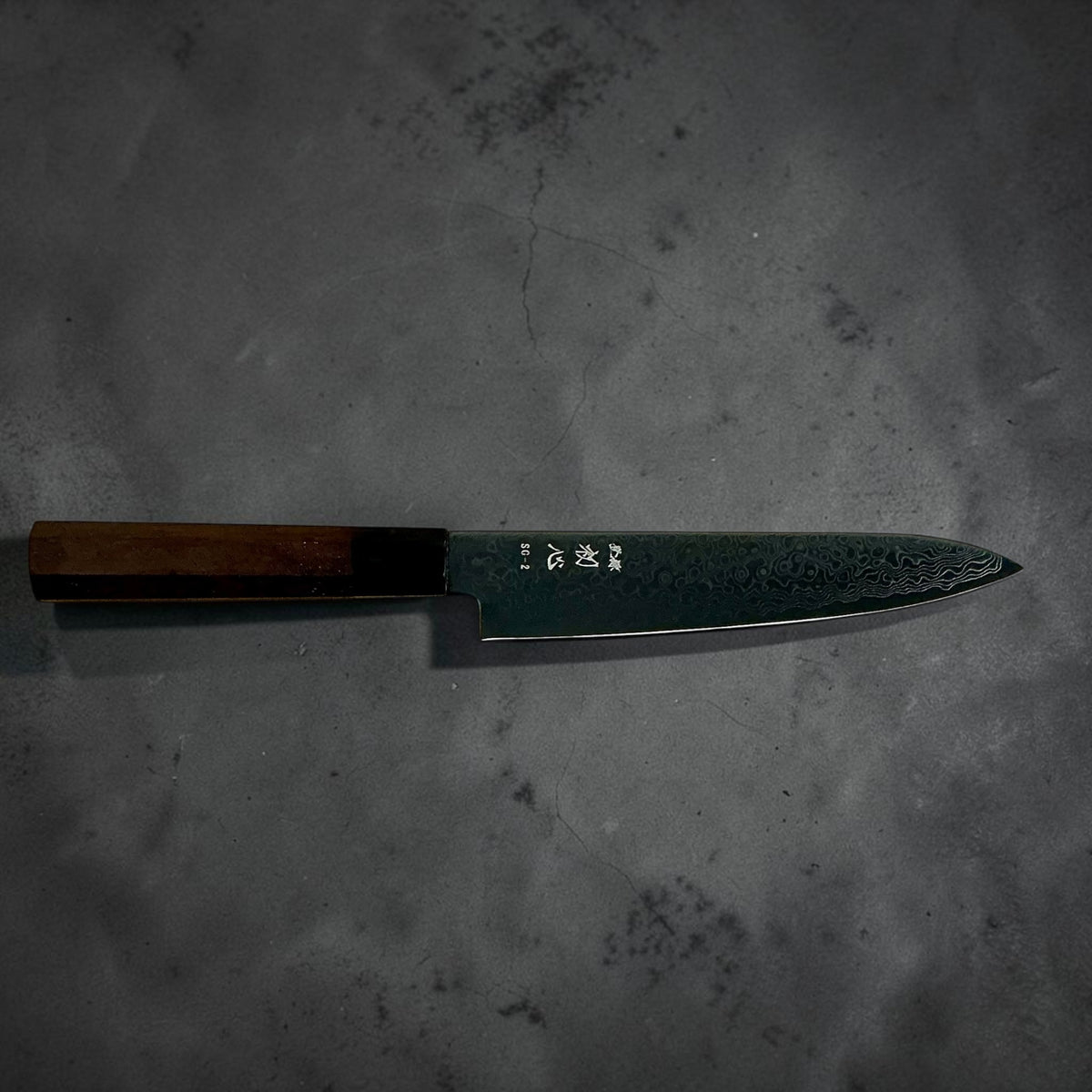 Hatsukokoro Ryuhyo SG2 black Damascus petty 150mm: Full side profile showing maker markings and walnut handle