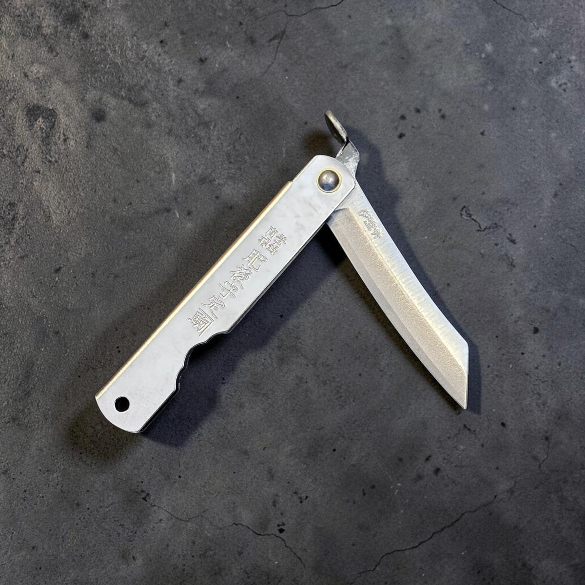 Higonokami carbon steel Japanese friction folder, silver handle with blade partially open. #size_medium - silver