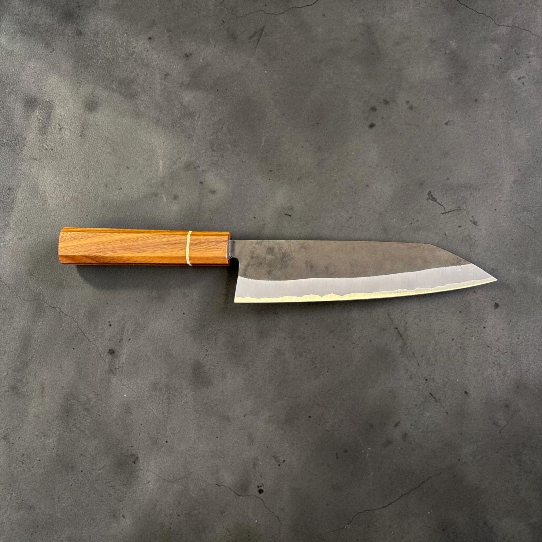 Left profile reference of the Imai AS Kurouchi Bunka 183mm showing the flat edge and pointed K-tip