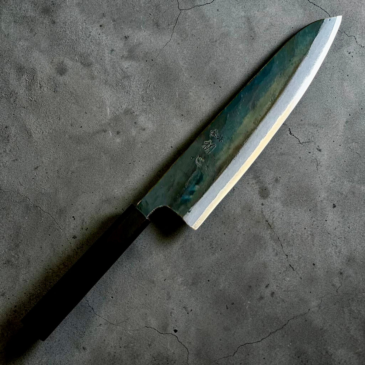 Kokugei Blue #1 kurouchi gyuto 210mm with mono ebony handle, angled full view