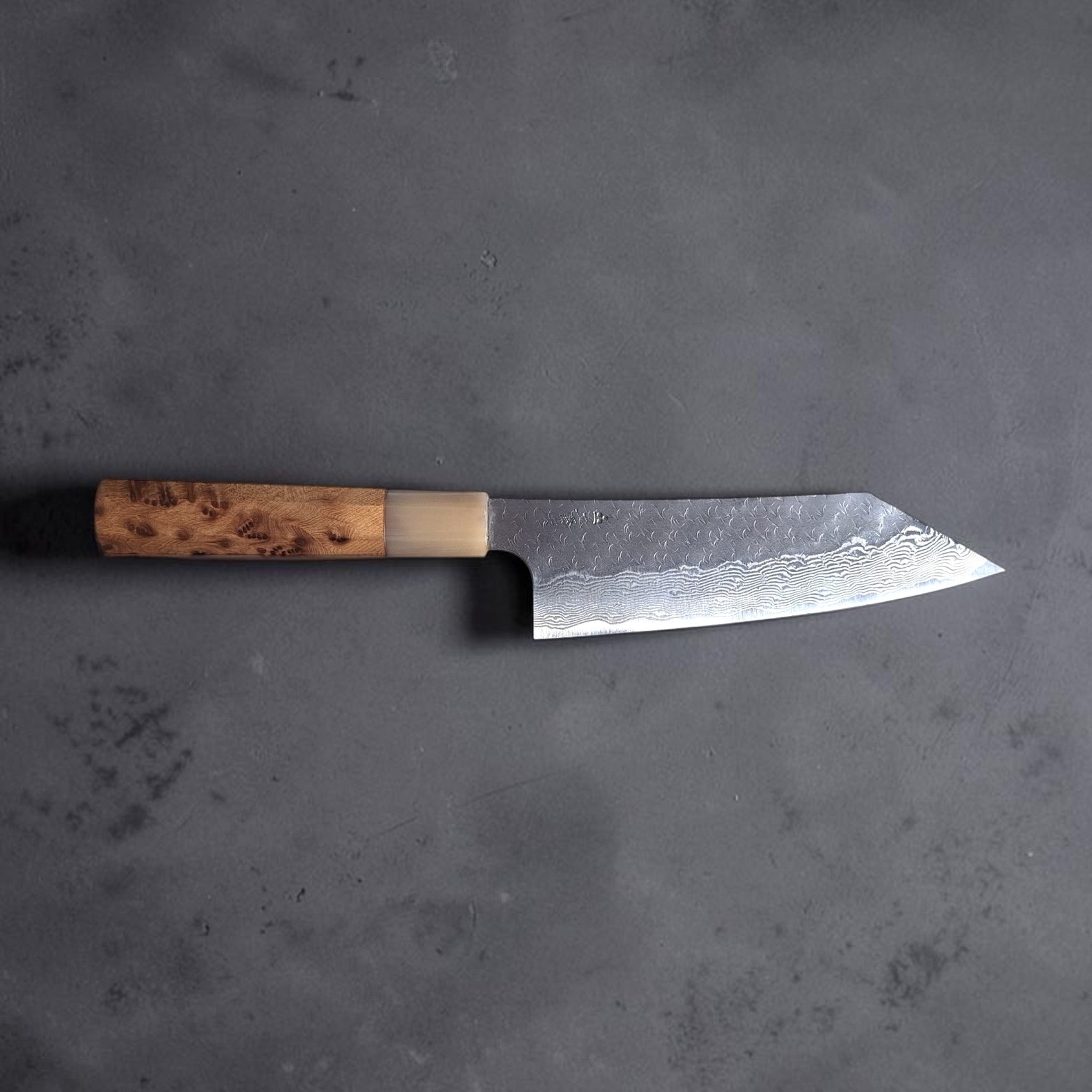 Nigara SG STRIX Tsuchime Damascus Bunka with Cypress Handle profile shot.