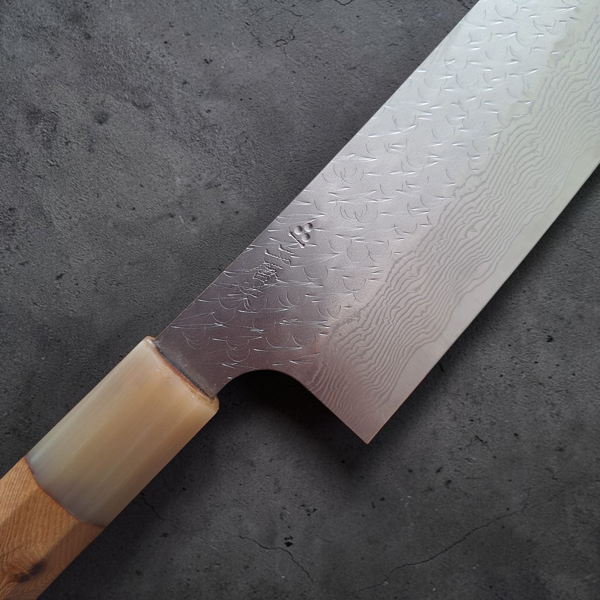 Nigara SG STRIX Tsuchime Damascus Bunka with cypress handle close-up.
