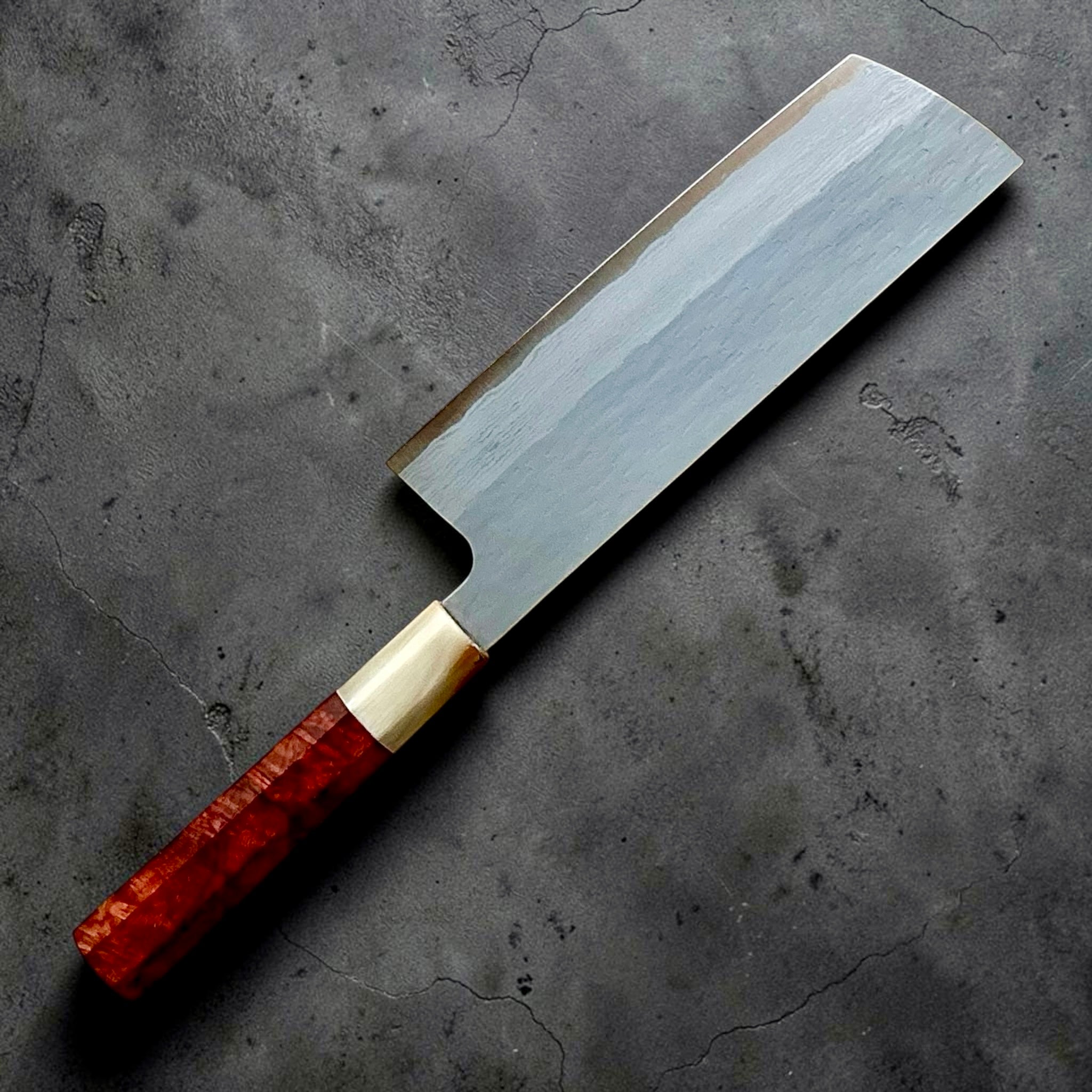Nigara VG-XEOS polished tsuchime nakiri 165mm, angled reverse blade view showing layered finish.