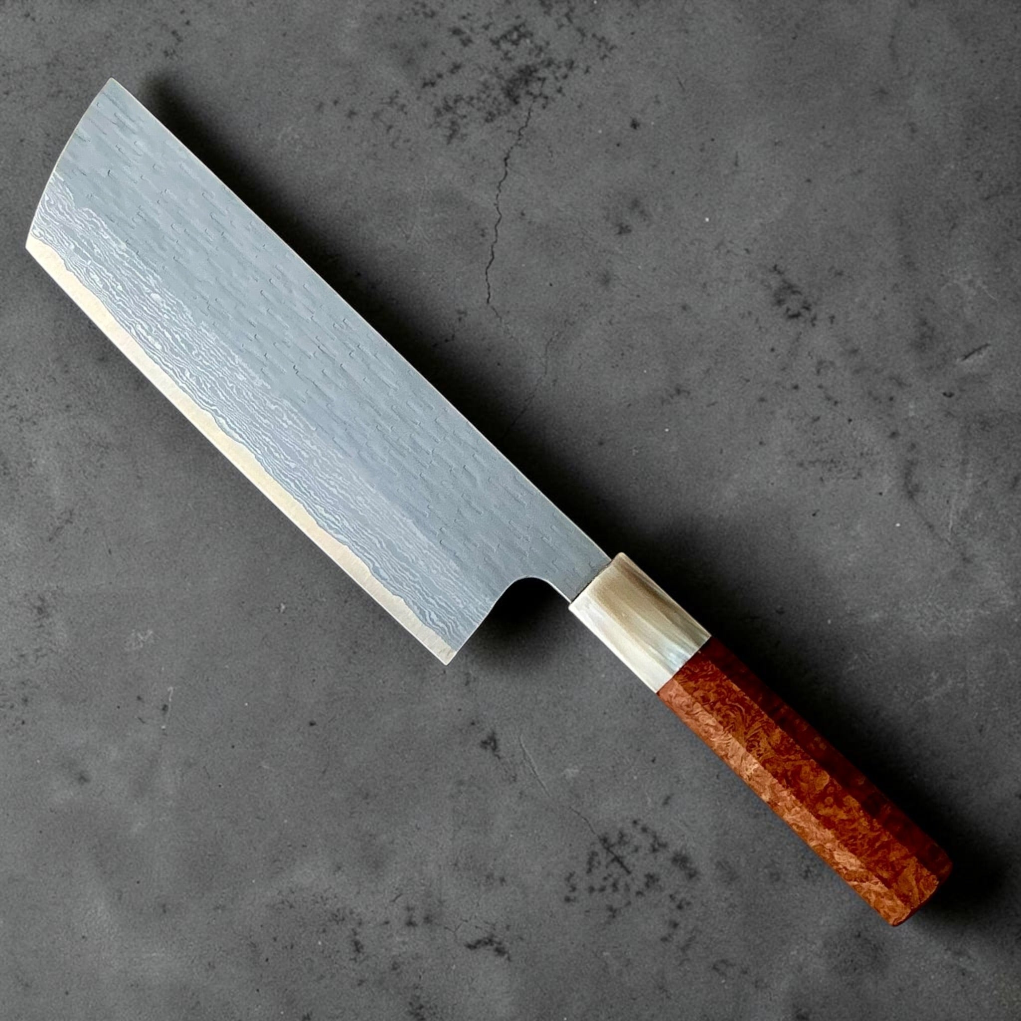 Nigara VG-XEOS polished tsuchime nakiri 165mm with cypress and buffalo horn handle, angled reverse view.