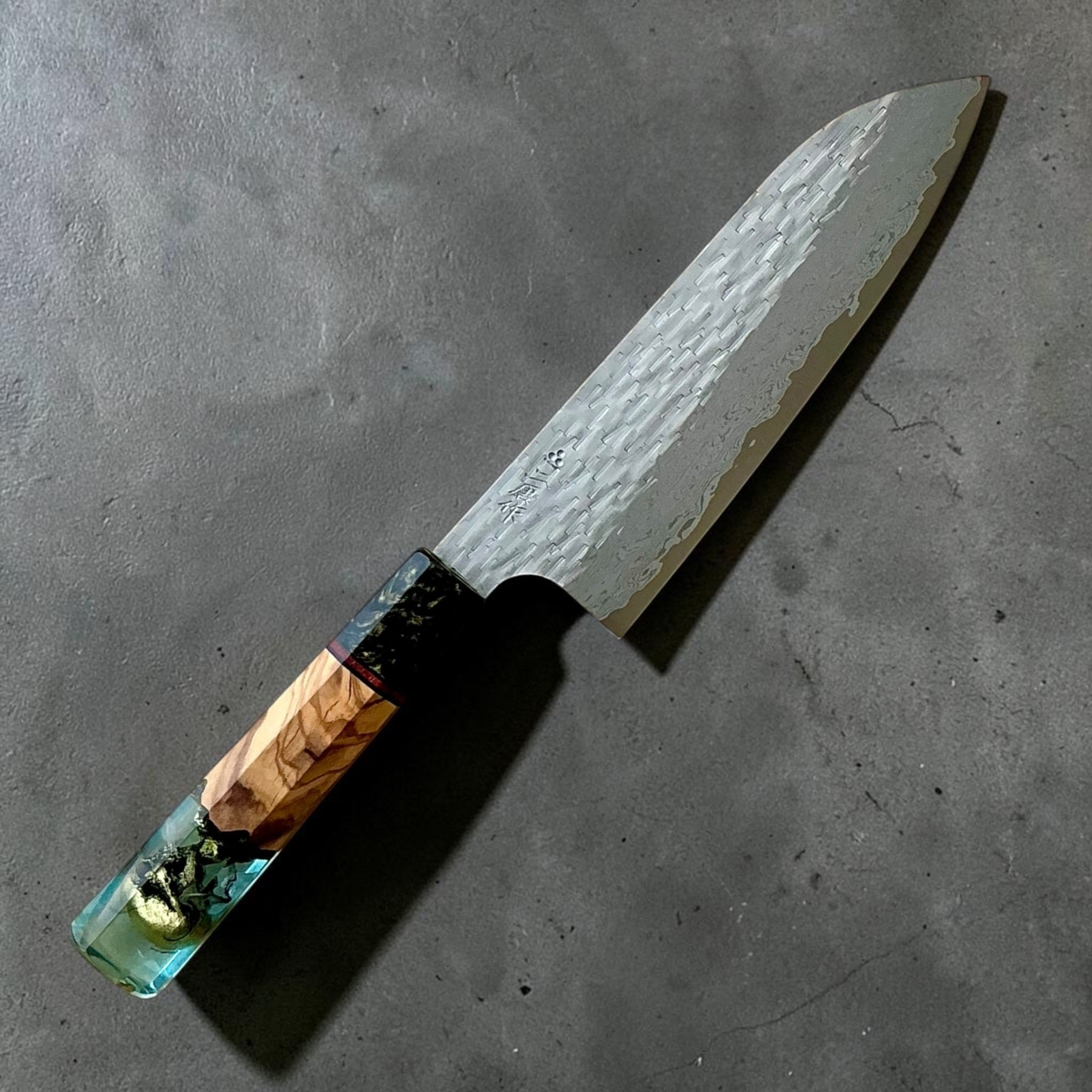 Nigara VG-XEOS polished tsuchime santoku 170mm with blue-green Prisma custom handle, kanji-side view.