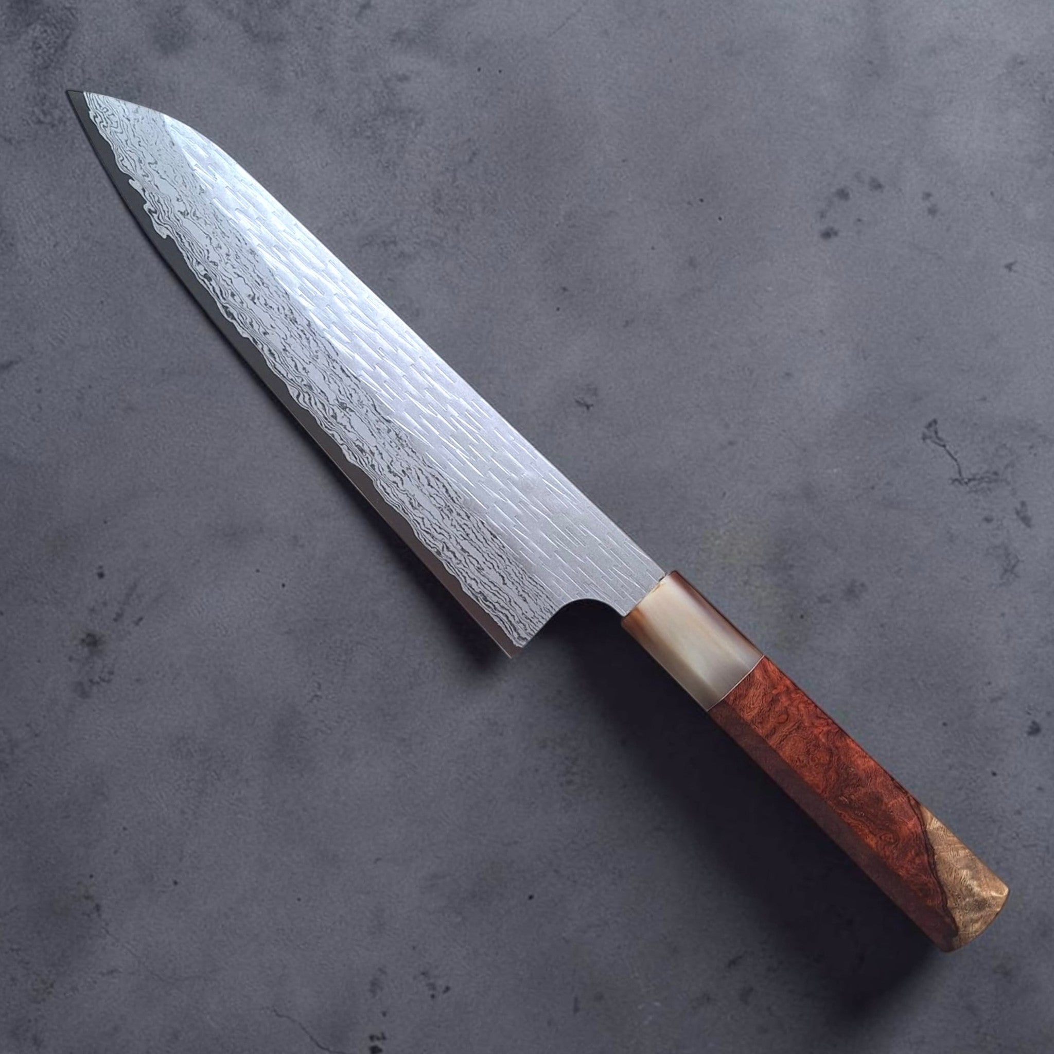 Nigara VG XEOS Tsuchime Gyuto 210 mm with amboyna burl and horn handle, reverse angled view showing the tsuchime and Damascus blade finish.