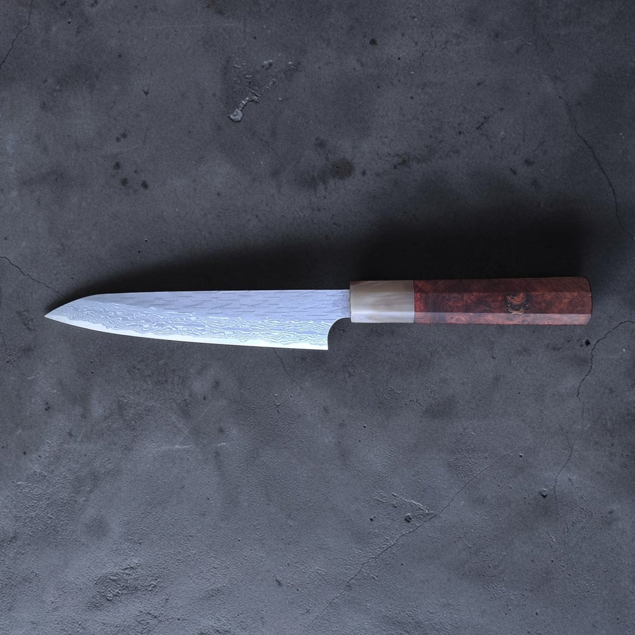 Choil shot showing the thin grind and cutting geometry.
