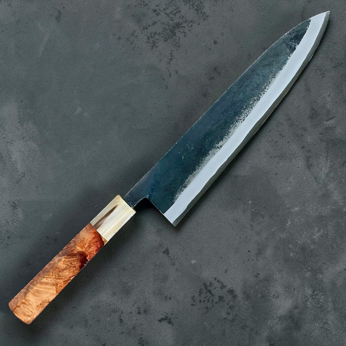 Tokushu Knife White No. 2 iron clad forged finish Gyuto 240 mm, amboyna with contrast & horn, angled front view #handle_amboyna with contrast & horn
